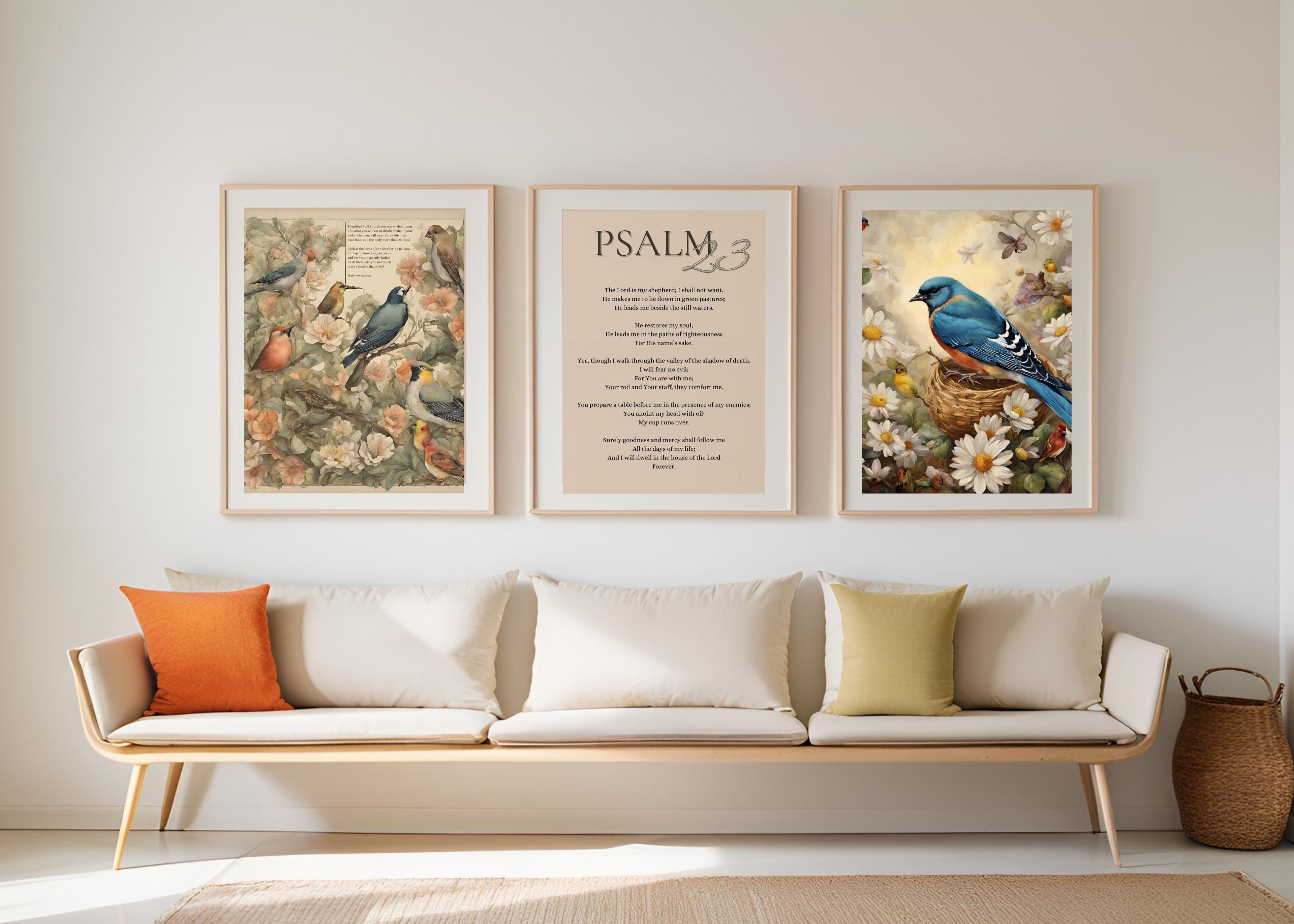 ravens and lilies artwork posters, white wall, modern couch with pop of orange and green pillows, modern and minimalistic living room